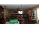 Spacious eat-in kitchen has wood cabinets, black appliances and tile floors at 3555 E Johnson Ave, Haines City, FL 33844
