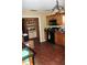 The outdated kitchen has wood cabinets, black appliances, and tile floors at 3555 E Johnson Ave, Haines City, FL 33844