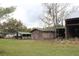 A barn with a shed, surrounded by a grassy field and trees, great for storage at 3555 E Johnson Ave, Haines City, FL 33844