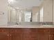 Double vanity bathroom with granite countertops at 100 S Eola Dr # 608, Orlando, FL 32801