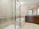 Modern bathroom with a large walk-in shower and a soaking tub at 100 S Eola Dr # 608, Orlando, FL 32801