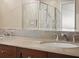 Bathroom with double sinks and a large shower at 100 S Eola Dr # 608, Orlando, FL 32801