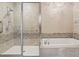 Spa-like bathroom featuring a walk-in shower and soaking tub at 100 S Eola Dr # 608, Orlando, FL 32801