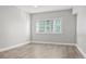 Bedroom with hardwood floors and large windows at 100 S Eola Dr # 608, Orlando, FL 32801