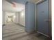 Building hallway with carpeted floors and apartment numbers at 100 S Eola Dr # 608, Orlando, FL 32801