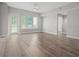 Spacious living room featuring hardwood floors and an open floor plan at 100 S Eola Dr # 608, Orlando, FL 32801