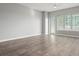 Bright living room with hardwood floors and access to balcony at 100 S Eola Dr # 608, Orlando, FL 32801