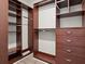 Custom walk-in closet with shelves, rods, and drawers at 100 S Eola Dr # 608, Orlando, FL 32801