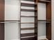 Large walk-in closet with shelves and hanging rods at 100 S Eola Dr # 608, Orlando, FL 32801