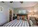 Bedroom with stylish gray bedding, and a walk-in closet at 3076 Crane Strand Dr, Winter Park, FL 32792