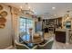 Elegant dining area featuring access to a well-equipped kitchen and an open floor plan at 3076 Crane Strand Dr, Winter Park, FL 32792