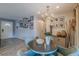 Stylish dining area with decorative wall art, chandelier, and contemporary furnishings at 3076 Crane Strand Dr, Winter Park, FL 32792