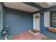 Inviting front porch with brick flooring and a decorative door, enhanced by stylish exterior accents at 3076 Crane Strand Dr, Winter Park, FL 32792