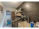 Well-organized laundry room with modern appliances, a sink, and storage shelves at 3076 Crane Strand Dr, Winter Park, FL 32792