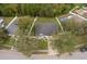 Aerial view of home with a black roof, fenced yard and neighborhood view at 516 Yellow Tail Pl, Chuluota, FL 32766