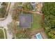 Aerial view of house with a fenced backyard and lots of tree coverage at 516 Yellow Tail Pl, Chuluota, FL 32766