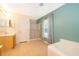 Bright bathroom featuring a shower, tub, and vanity with neutral tile flooring at 516 Yellow Tail Pl, Chuluota, FL 32766