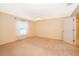 Bedroom features carpeted floor, ceiling fan, and natural light from the window at 516 Yellow Tail Pl, Chuluota, FL 32766