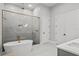 Spa-like bathroom featuring a freestanding tub and walk-in shower at 5762 Emerington Cres, Orlando, FL 32819