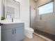 Modern bathroom with a frameless shower and gray vanity at 5762 Emerington Cres, Orlando, FL 32819