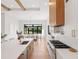 Modern kitchen with white cabinetry, a large island, and a breakfast nook at 5762 Emerington Cres, Orlando, FL 32819