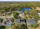 Single-Gathering home with solar panels and a screened pool near a lake at 1657 Carillon Park Dr, Oviedo, FL 32765