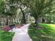 Enjoy a relaxing stroll along the community path, shaded by lush trees at 1657 Carillon Park Dr, Oviedo, FL 32765