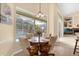 Bright dining area with views of the pool and patio at 1657 Carillon Park Dr, Oviedo, FL 32765