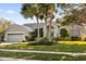 House exterior showcasing a well-maintained lawn and attractive facade at 1657 Carillon Park Dr, Oviedo, FL 32765