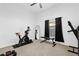 Home gym with exercise bike and weight bench at 1657 Carillon Park Dr, Oviedo, FL 32765