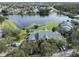 Aerial view of community featuring mature trees and waterfront views at 2533 Grassy Point Dr # 205, Lake Mary, FL 32746