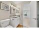 Bathroom featuring granite counters, vanity and sink with access to bedroom at 2533 Grassy Point Dr # 205, Lake Mary, FL 32746