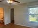 Bedroom featuring a ceiling fan, wood floors, closet access, and natural light from a window at 2533 Grassy Point Dr # 205, Lake Mary, FL 32746