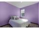 Lavender bedroom with a double bed and window at 326 Highland Meadows Ave, Davenport, FL 33837