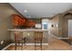 Kitchen with wooden cabinets and a breakfast bar at 326 Highland Meadows Ave, Davenport, FL 33837