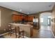 Kitchen features wooden cabinets and breakfast bar at 326 Highland Meadows Ave, Davenport, FL 33837