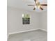 Bright bedroom with ceiling fan and light gray vinyl plank flooring at 733 Preble Ave, Altamonte Springs, FL 32701