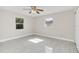 Spacious bedroom with light gray wood-look floors and ceiling fan at 733 Preble Ave, Altamonte Springs, FL 32701