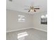 Bright bedroom with ceiling fan and light gray wood-look floors at 733 Preble Ave, Altamonte Springs, FL 32701