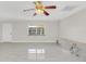 Living room with light gray vinyl plank flooring and marble accent wall at 733 Preble Ave, Altamonte Springs, FL 32701