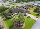 Aerial view of house showing landscaping, driveway and surrounding neighborhood at 10 Pilot Pl, Winter Haven, FL 33881