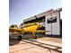 Yellow airplane parked outside hangar at 10 Pilot Pl, Winter Haven, FL 33881