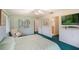 Cozy bedroom with soft green walls, ceiling fan, and a large window for natural light at 10 Pilot Pl, Winter Haven, FL 33881