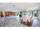 Open-concept living and dining space, featuring tile floors and an abundance of natural light at 10 Pilot Pl, Winter Haven, FL 33881