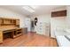 Functional home office with built-in desk, ample storage, and hardwood floors at 10 Pilot Pl, Winter Haven, FL 33881
