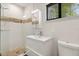 Modern bathroom with tiled shower, floating vanity, and updated fixtures at 12550 Lakeshore Dr, Clermont, FL 34711