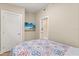 Neutral bedroom featuring an entrance hall, television, and overhead lighting at 12550 Lakeshore Dr, Clermont, FL 34711