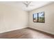 Cozy bedroom with hardwood floors and a bright window at 12550 Lakeshore Dr, Clermont, FL 34711