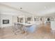 Dining room with a clear table, fireplace, hardwood floors, and open floor plan at 12550 Lakeshore Dr, Clermont, FL 34711