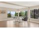 Dining room with large windows offering natural light and hardwood floors at 12550 Lakeshore Dr, Clermont, FL 34711